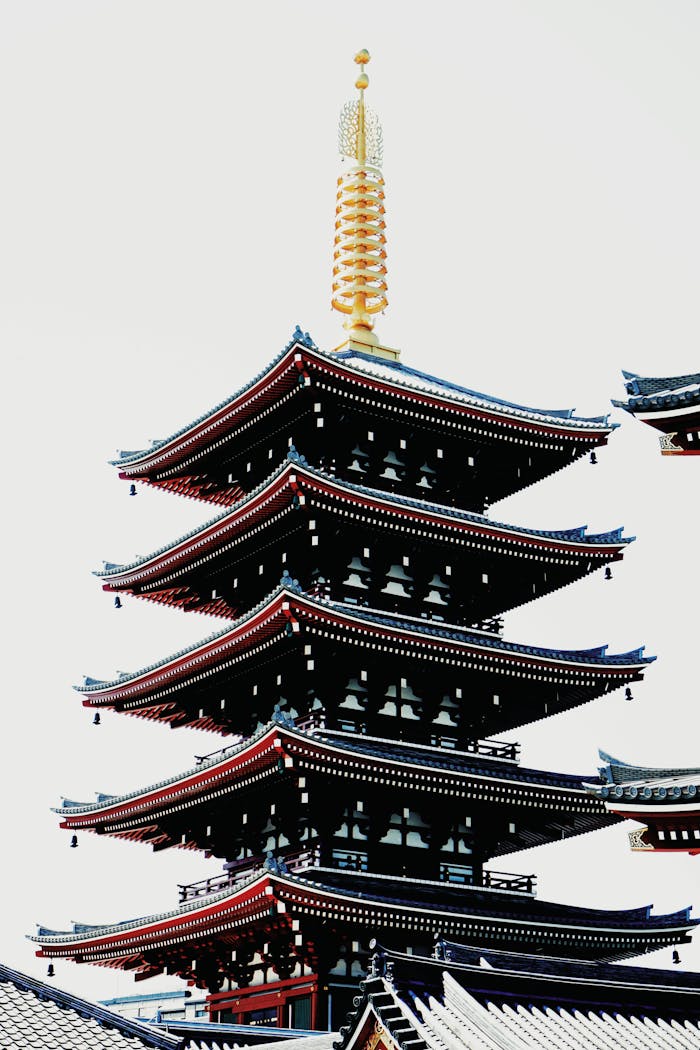 Vertical view of the Senso-ji Temple pagoda, a prominent Tokyo landmark, during the day.